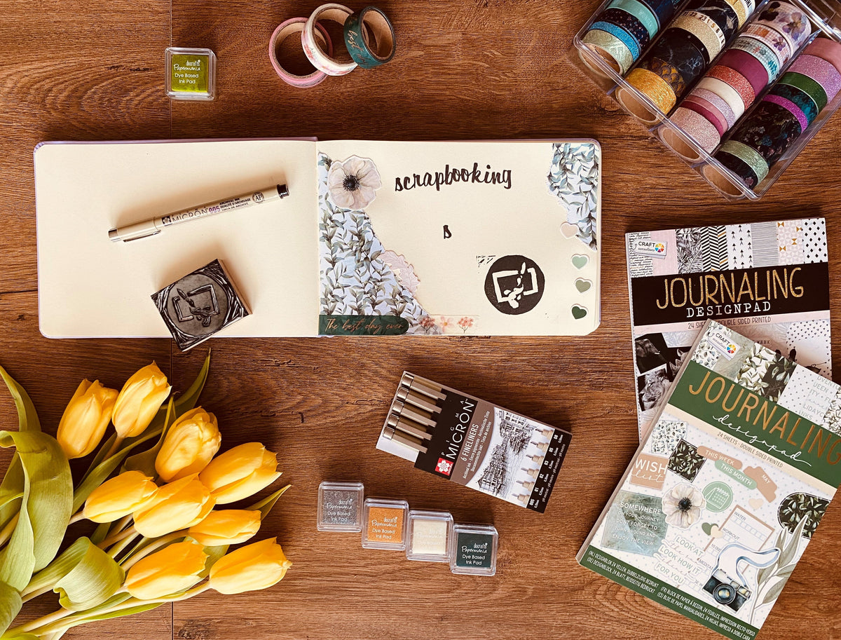 Kreatives Scrapbooking-Set mit Papieren und Dekorationen
